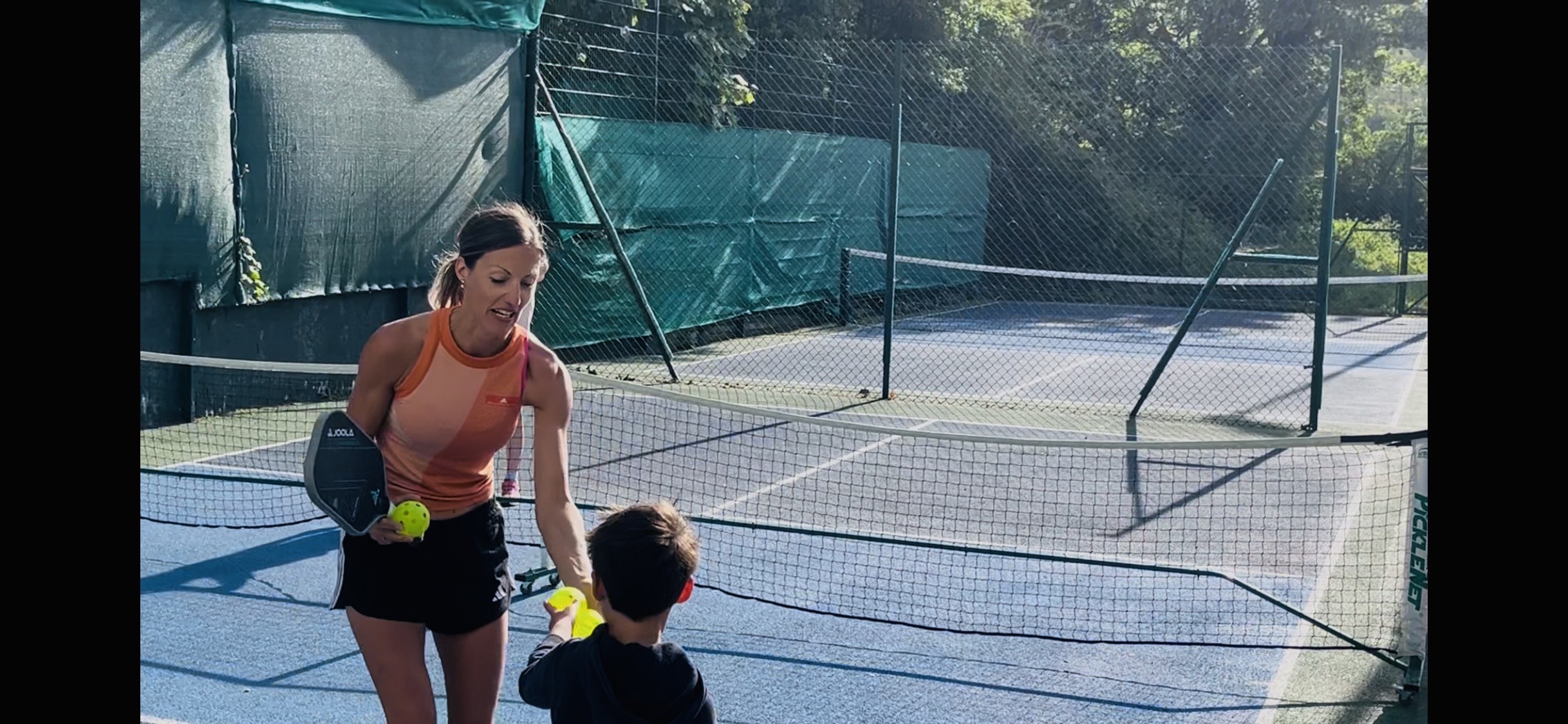 Lucy Grant coaching children's pickleball